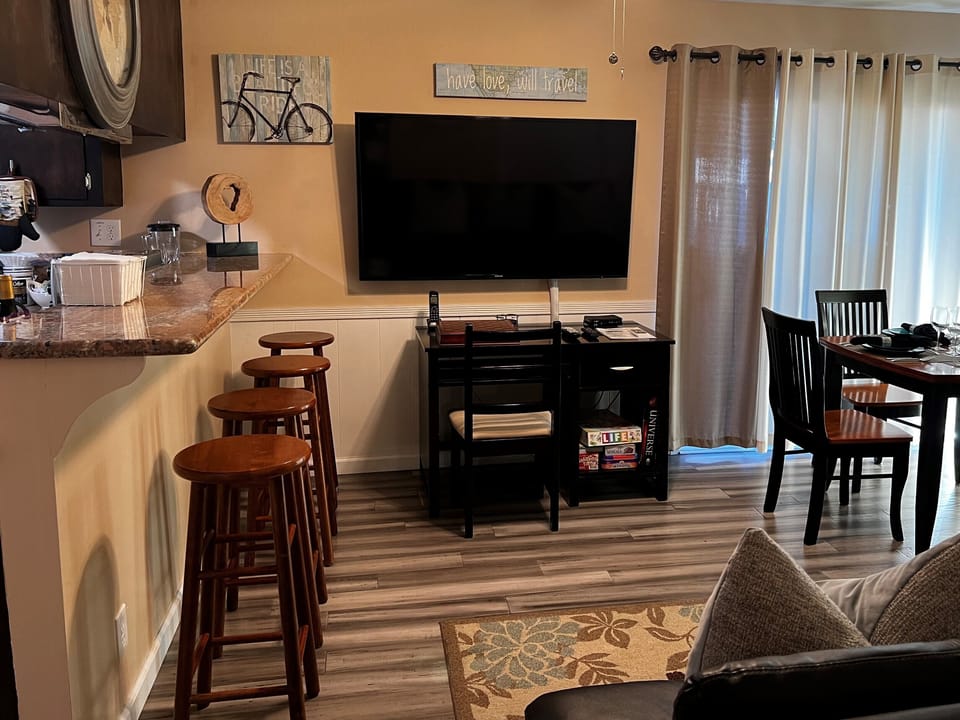 Family/Dining Room - dining table, desk w/chair, LCD TV, dining counter for 4