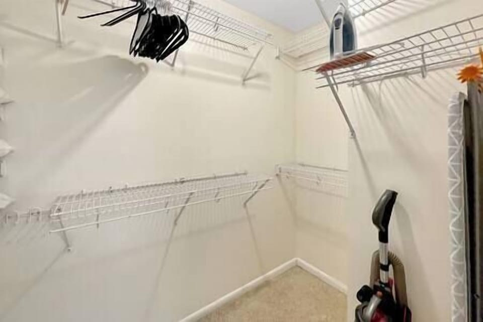 Master walk in, has iron, ironing board, extra pillow, vacuum and hangers.