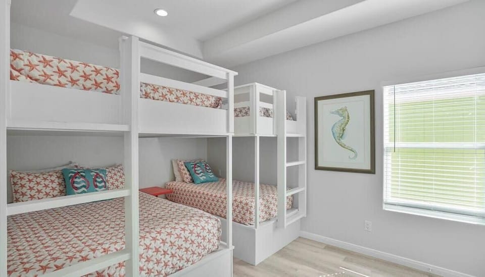 Bunk room with 2 queen size & 2 twin size beds.  Enjoy a SMART TV in this room as well.