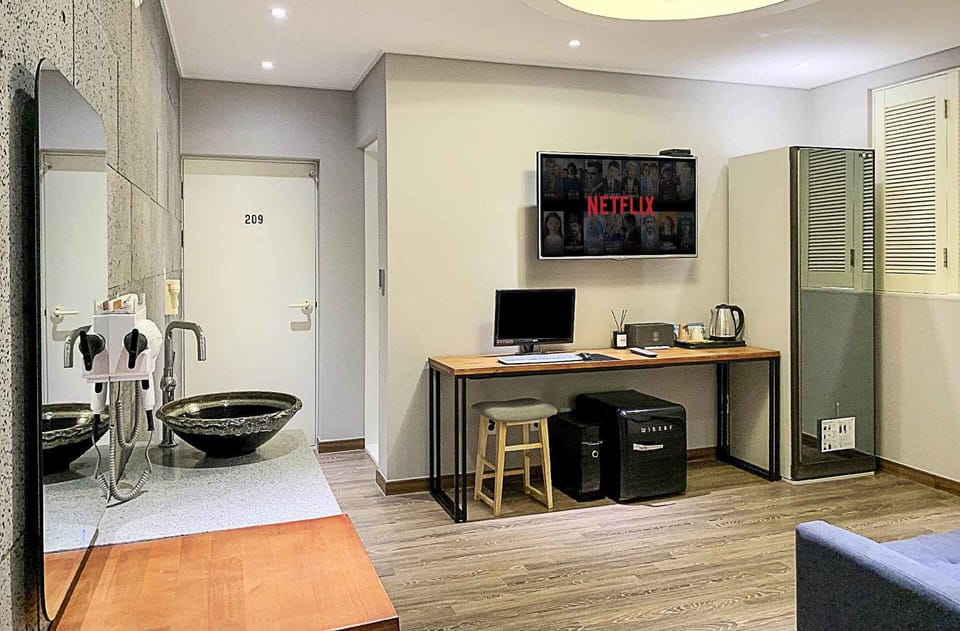 Signature Studio Suite | Premium bedding, down comforters, memory foam beds, desk