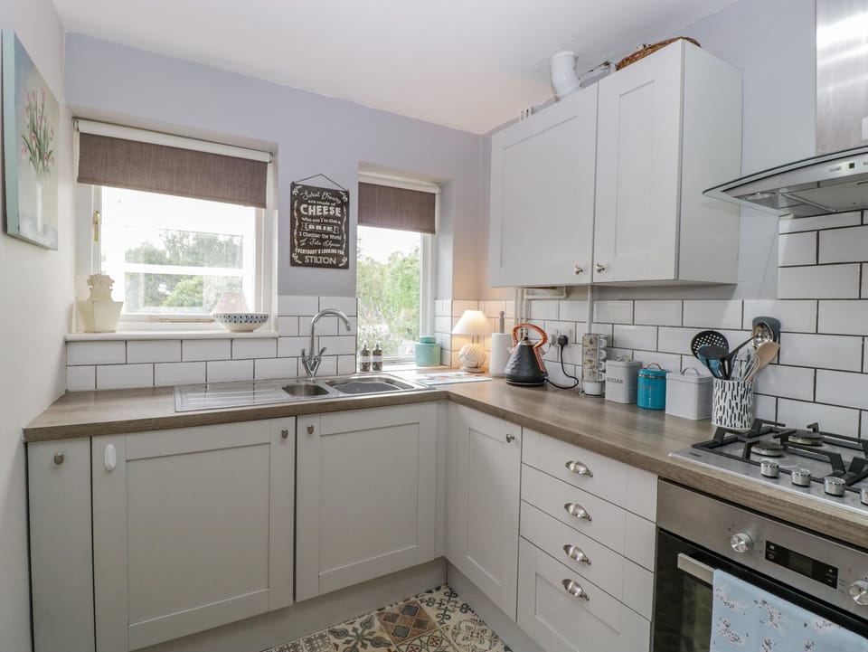 Fridge, electric kettle, cookware/dishes/utensils