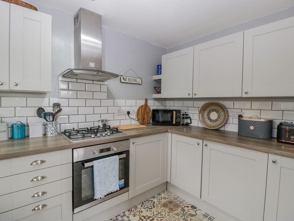 Fridge, electric kettle, cookware/dishes/utensils