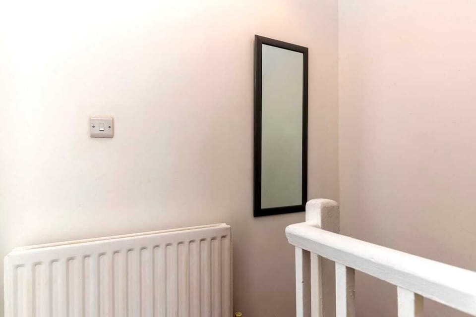 A convenient view of the bright bathroom with a spacious king-size bed or two separate singles, giving you the flexibility to suit your needs.
