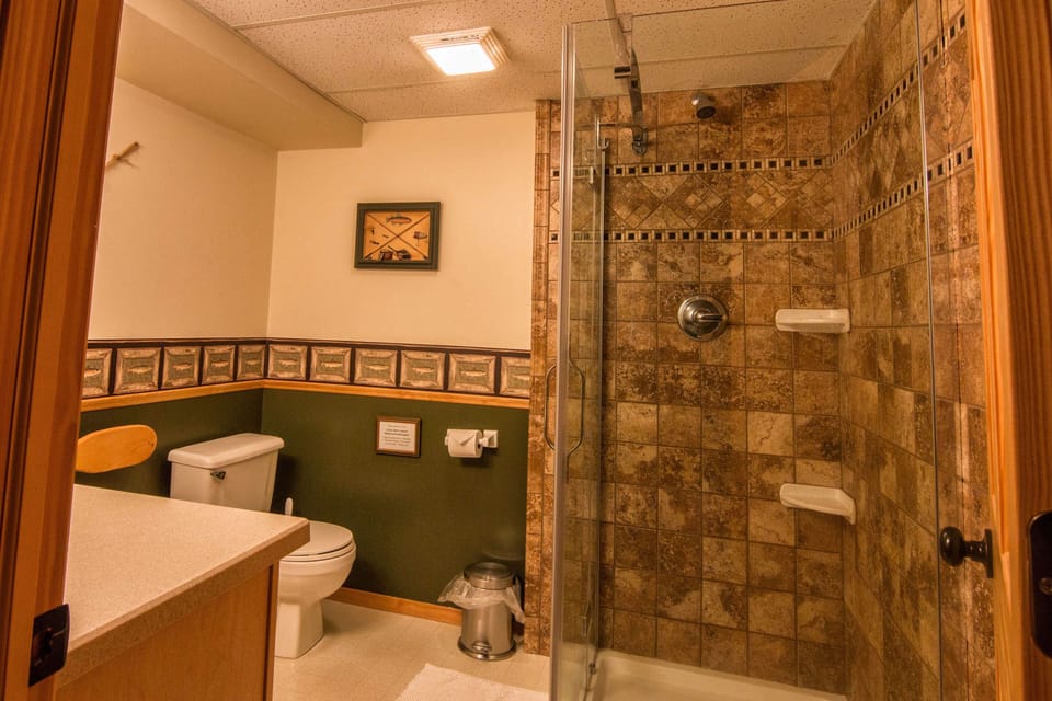 Basement bathroom in hallway outside of bedrooms