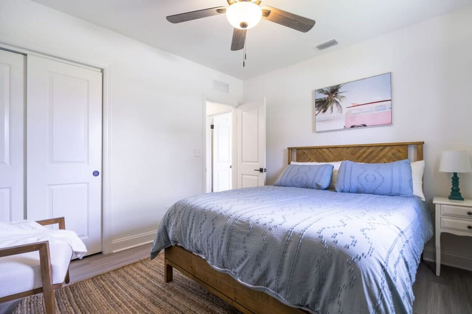 Relax in the primary suite featuring a king bed, Smart TV, and a convenient private en suite bathroom.