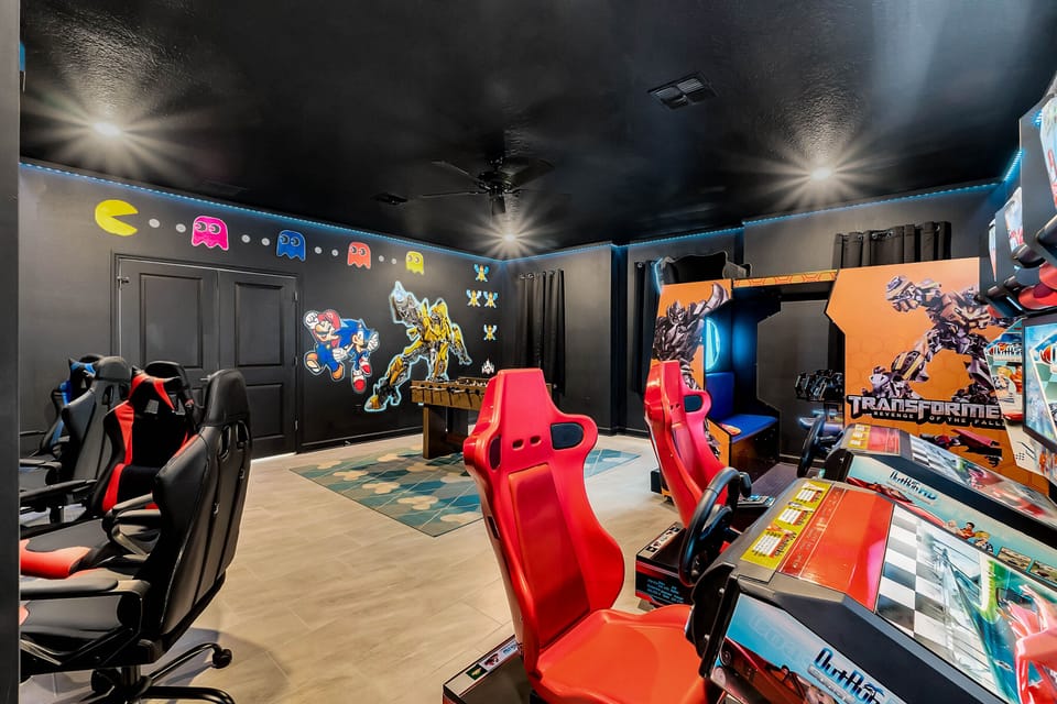 Game Room with commercial arcade Transformers and Race Car games 