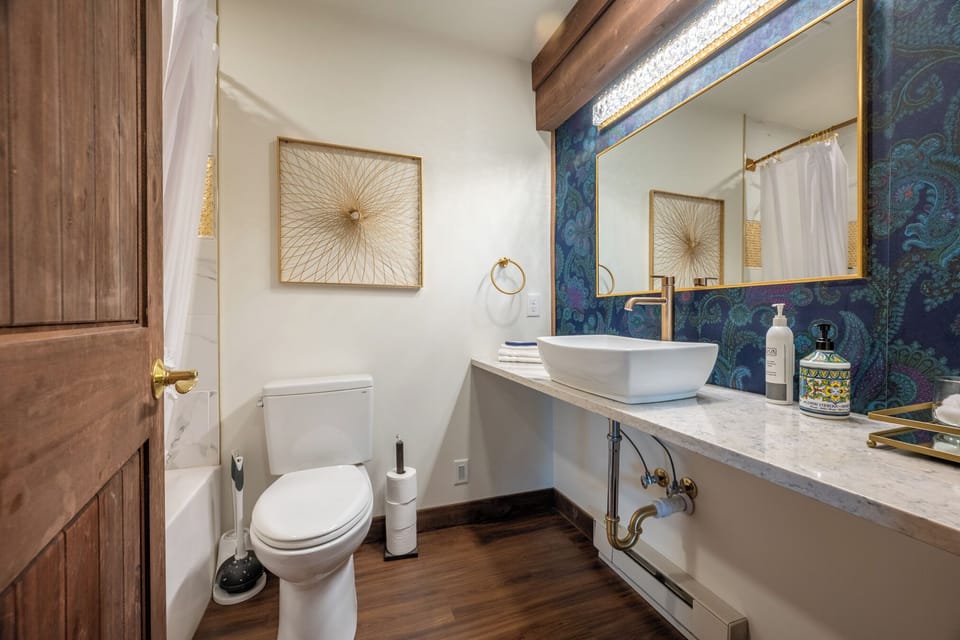 Clean and functional, the full bathroom includes a tub/shower combo—perfect for relaxing after a day out or getting the kids cleaned up before bed. Stocked with essentials and ready for your stay.