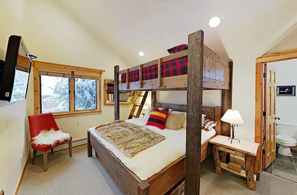 Bunk Bed with Queen bed on top of King bed and a twin trundle below King bed.