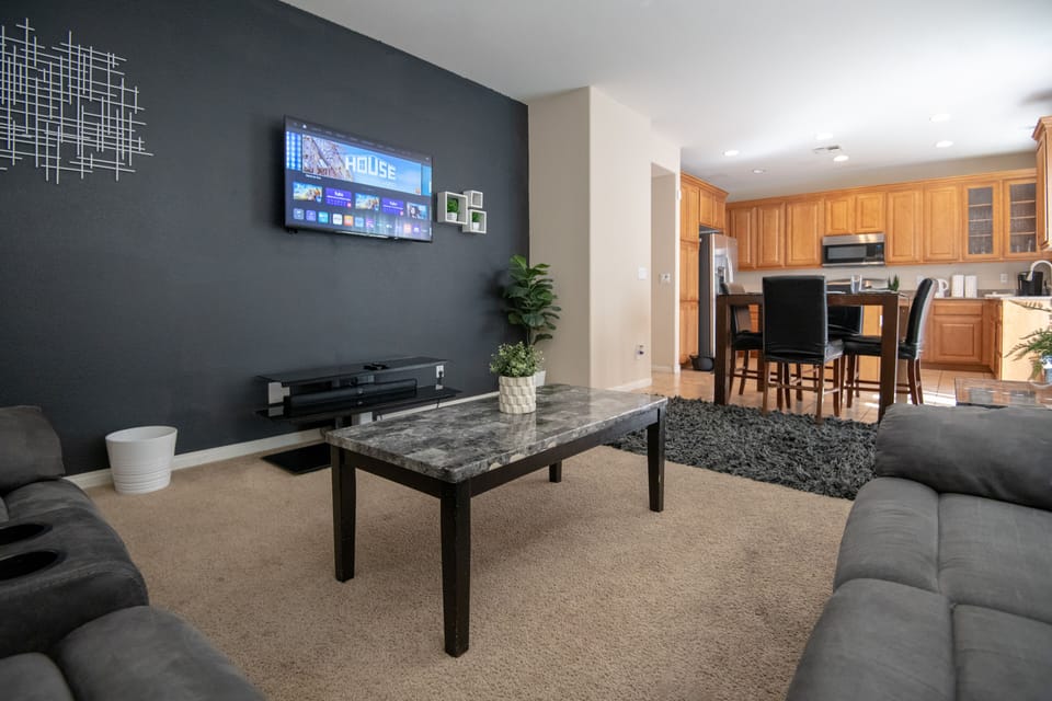 Second family room and entertainment den, full couch and recliner and 55in TV 