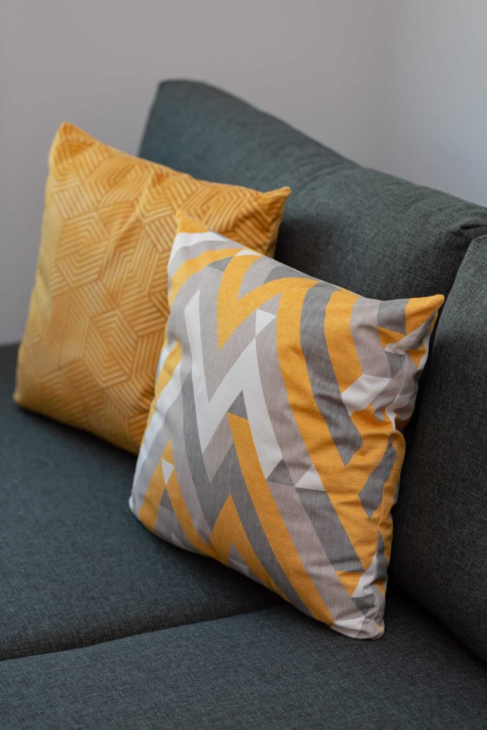 Close-up of the soft, decorative cushions that bring a cosy atmosphere.
