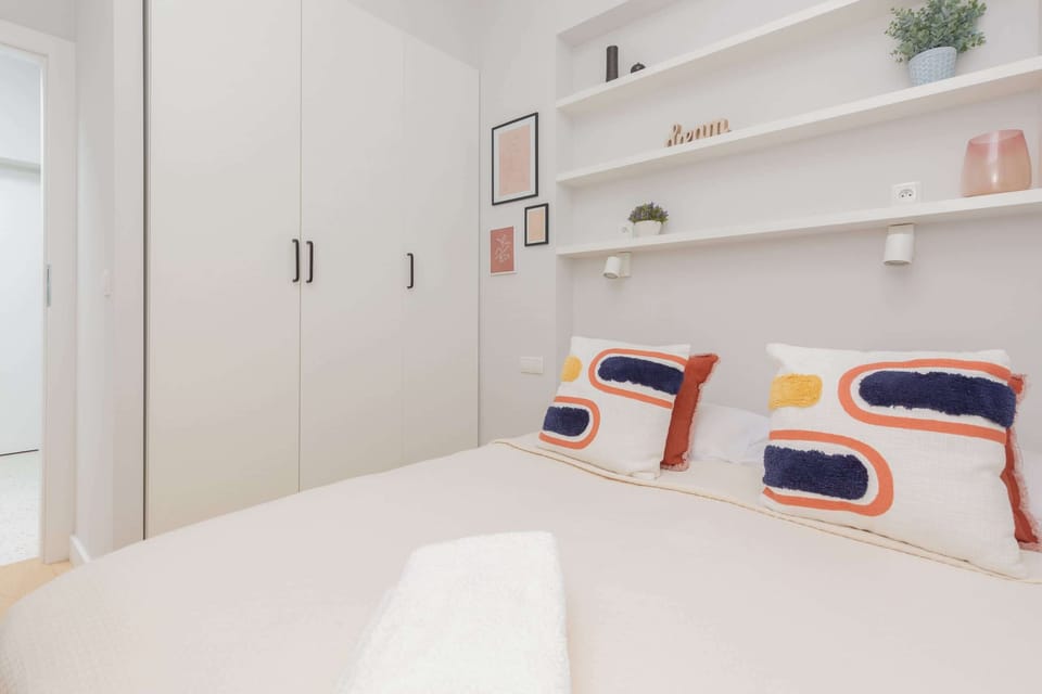 A bright, cosy bedroom with a comfortable double bed and a spacious wardrobe that can accommodate all your luggage and household accessories.