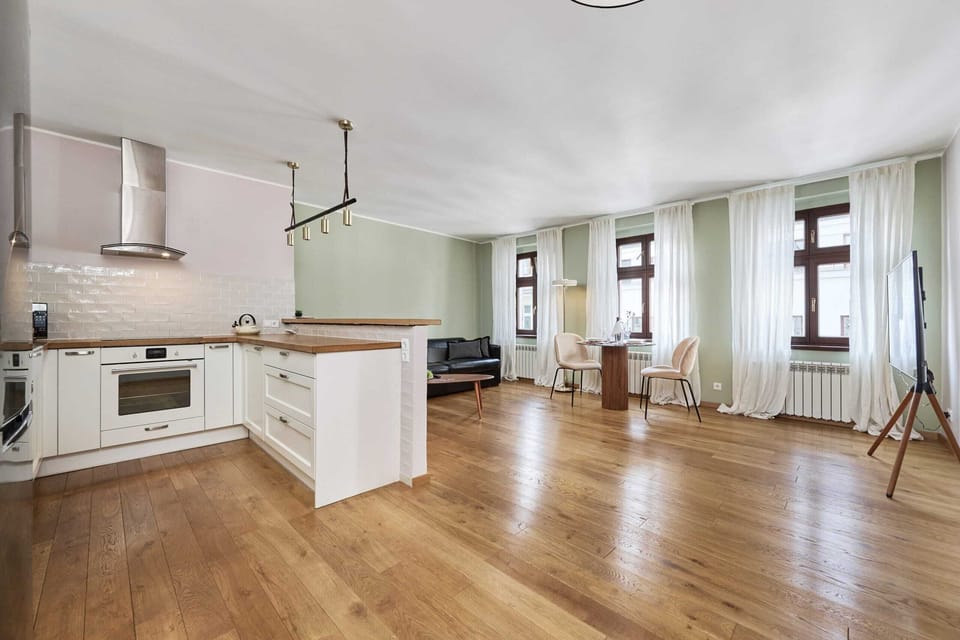 Kitchen space with plenty of storage, white cabinets, and modern appliances, designed for both function and style.