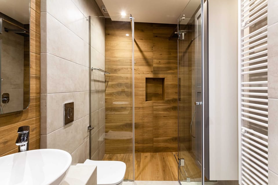 Modern Bathroom Area with Wooden Accents and White Fixtures
