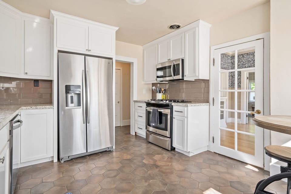 Kitchen heading to first floor bedroom and bath