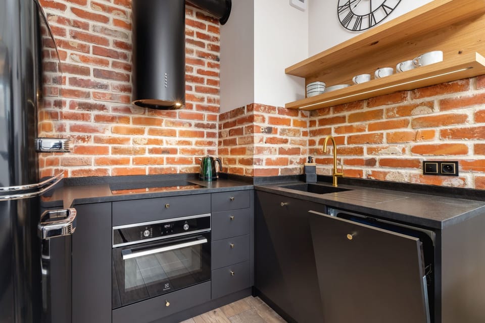The sleek design of the kitchenette blending seamlessly with the living area.
