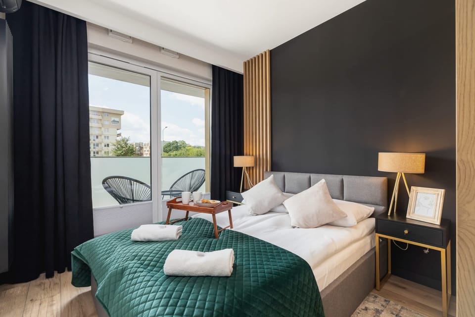 The cosy bedroom features a luxurious double bed and ample storage.