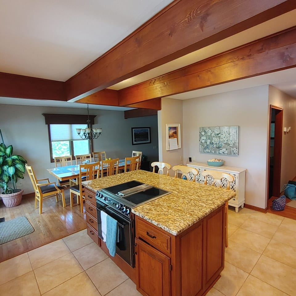 Breakfast-kitchen area with table with extra leaves for large families.  Storage