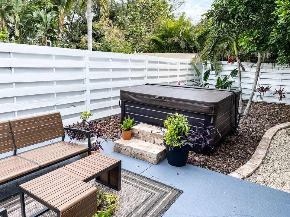 Private hot tub in a fenced backyard
