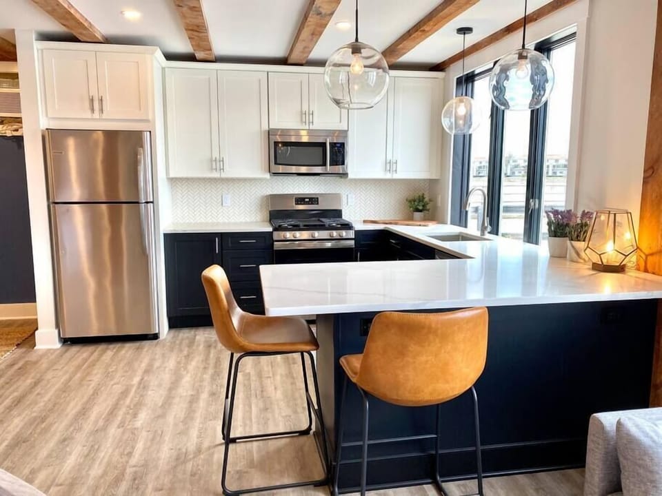 Gourmet kitchen, fully stocked with coffee maker and all cooking amenities.