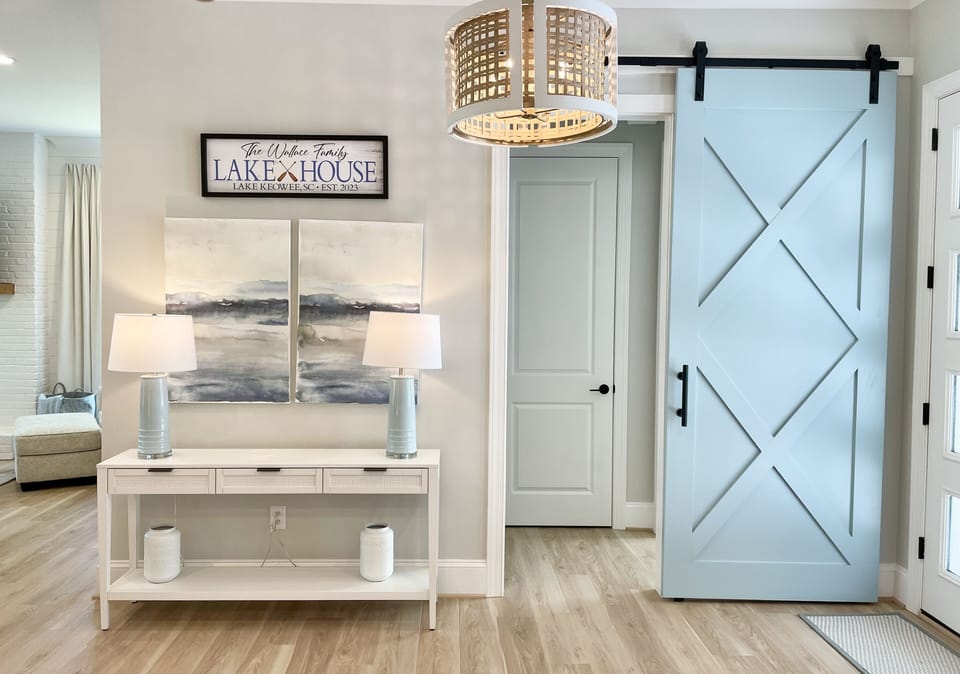 Barn door closes to create another private guest suite  with king bed