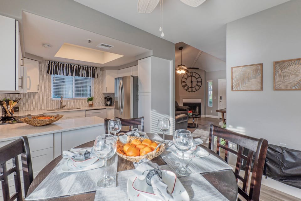 Completely stocked kitchen has table seating for 4.