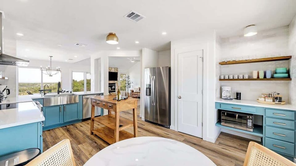Home chefs will enjoy cooking in the modern kitchen with a coffee nook.