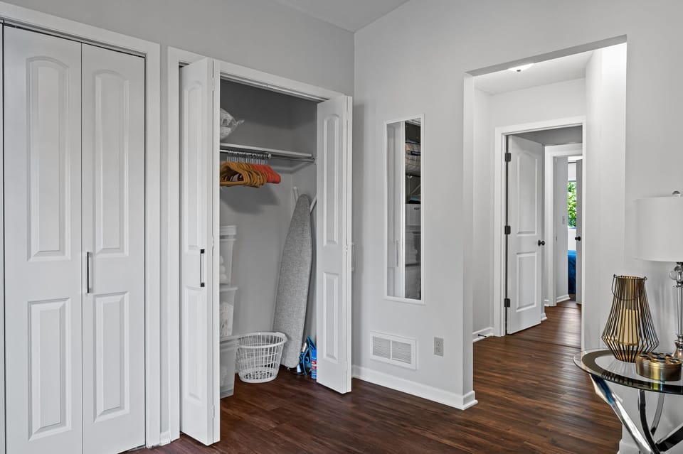 Main bedroom: ironing & ironing board. Extra sheets and towels.