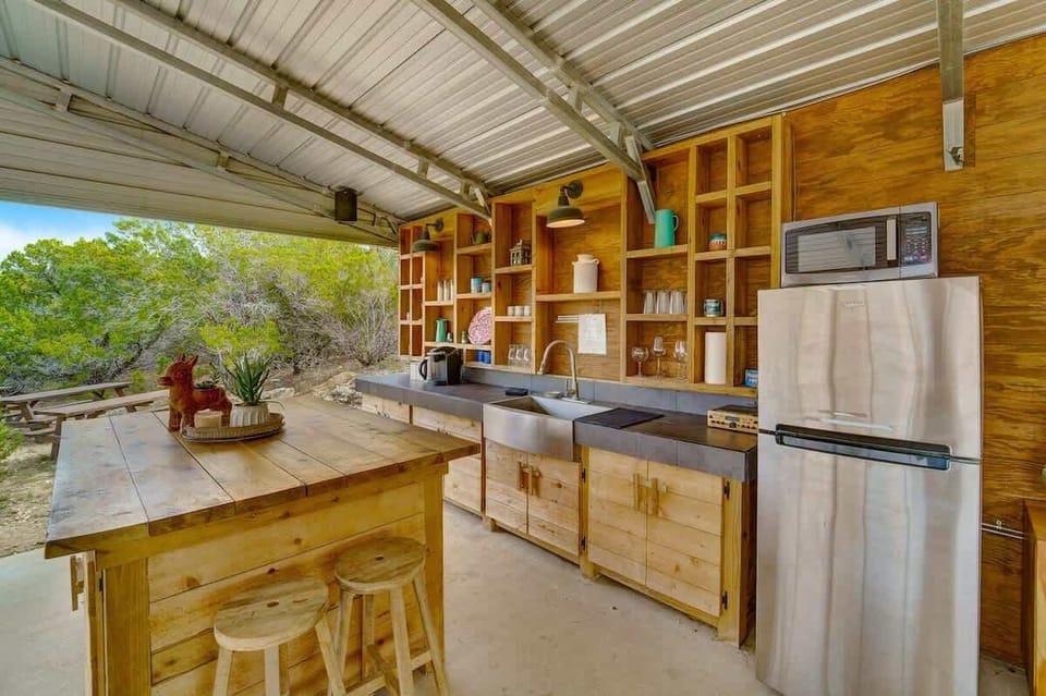 Our outdoor kitchen where you can enjoy conversations over amazing barbecue!