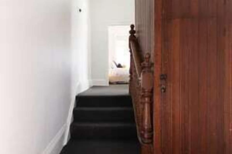 Make your way down the internal hallway staircase