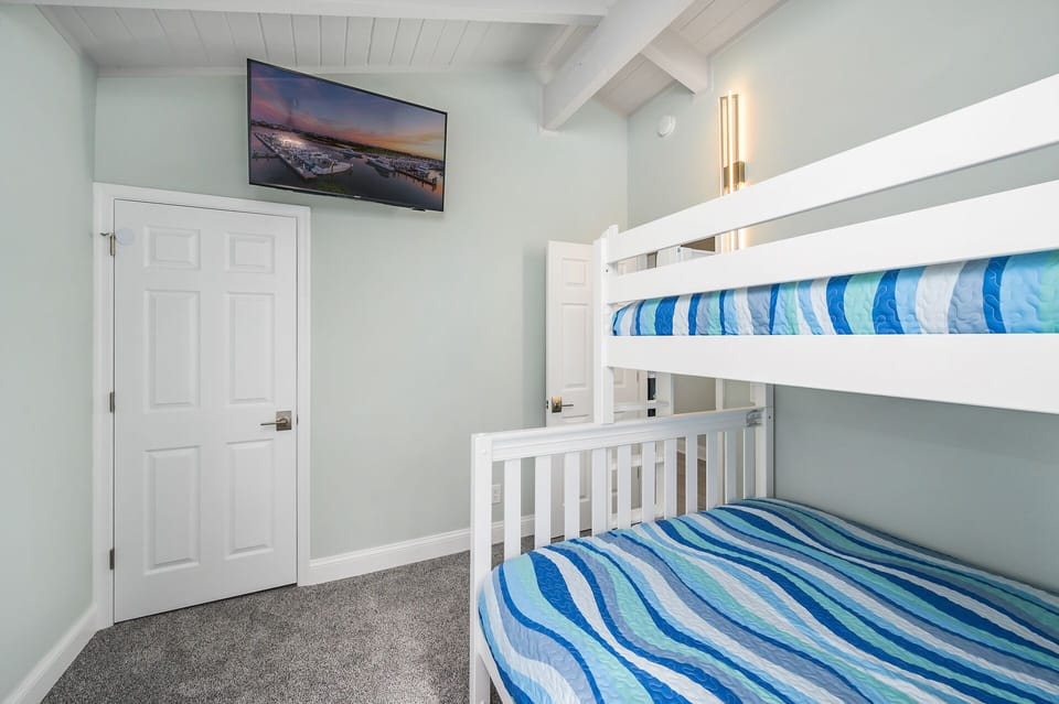 This bedroom offers a pyramid bunk & streaming TV