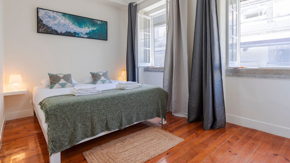 This bedroom has a comfortable queen-size bed and is full of natural light for you to wake-up feeling refreshed #bright #comfort #portugal #pt #lisbon