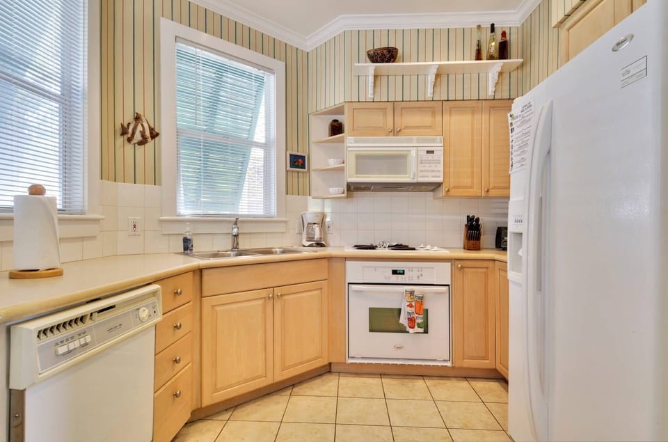 A light-colored full kitchen awaits!
