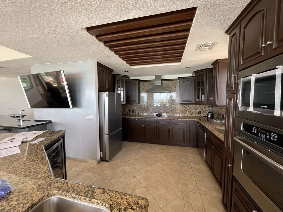 Kitchen with 2 sinks, island and new stainless steel appliances 