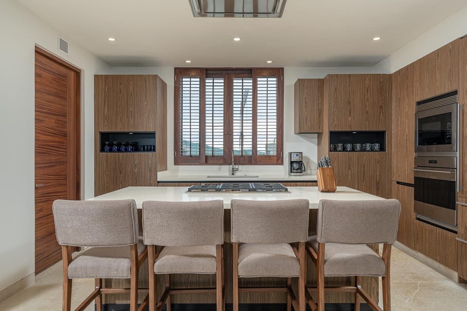 Dine in chef’s kitchen with Sub Zero and Wolf appliances.