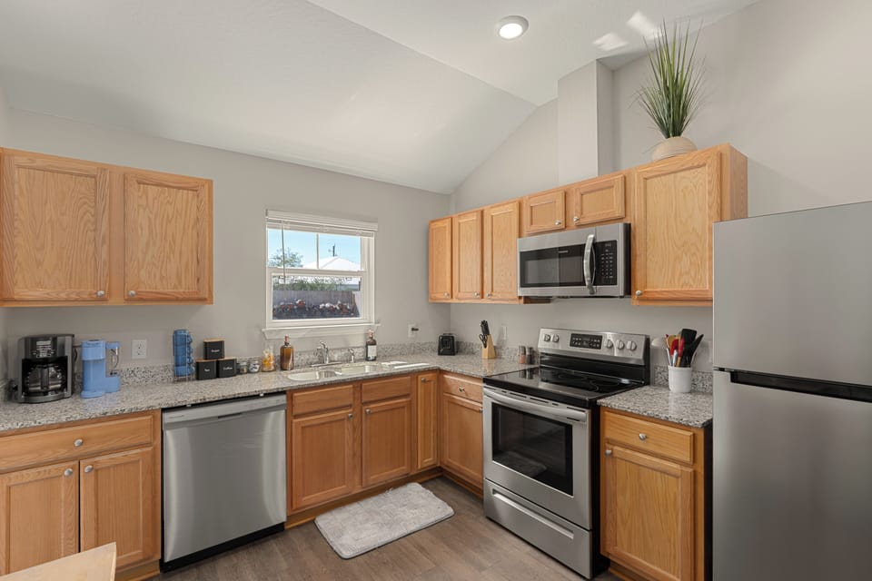 Kitchen with stainless appliances, granite counters, and everything needed for easy meals at home.