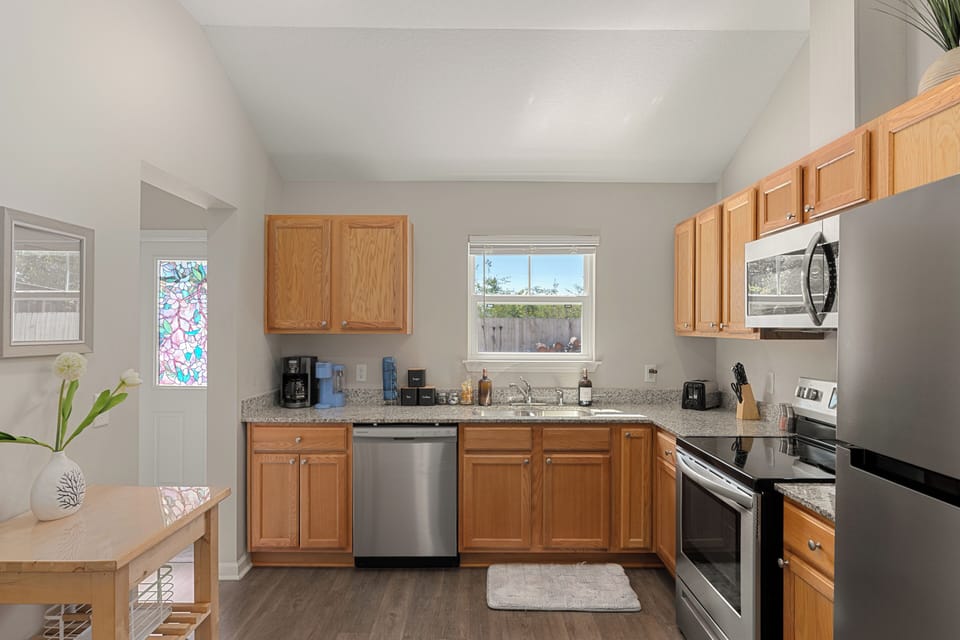Kitchen with stainless appliances, granite counters, and everything needed for easy meals at home.