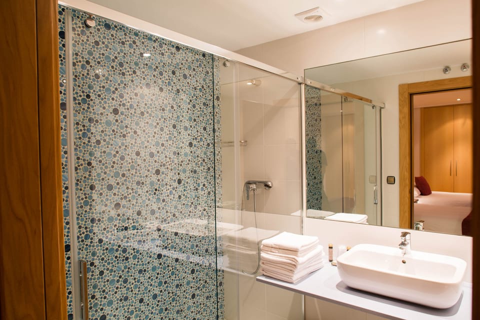 Superior Double Room | Bathroom | Deep soaking tub, rainfall showerhead, free toiletries, hair dryer