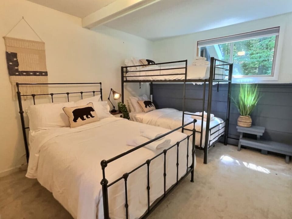 Welcome to our spacious bedroom, perfect for adventures and cozy nights, with a luxurious double bed and charming bunk beds.