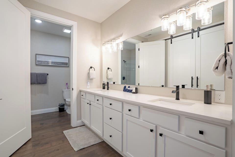 Master Bathroom with large double bowl vanity and large closet