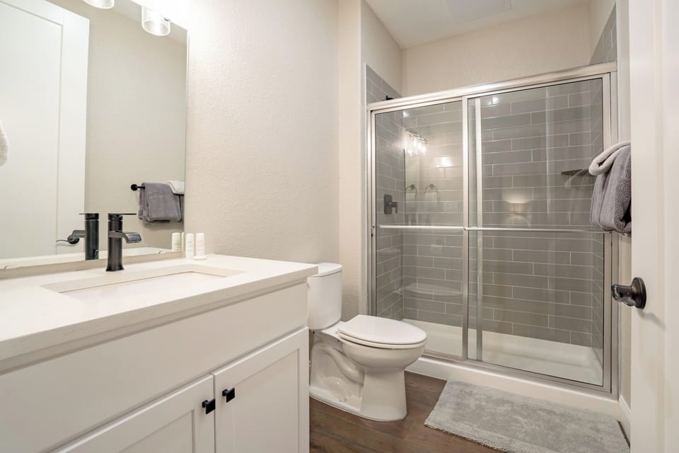 Queen bedroom private bathroom with sink and shower
