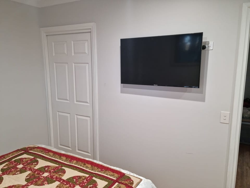 Queen master bed with its own 42" HDTV