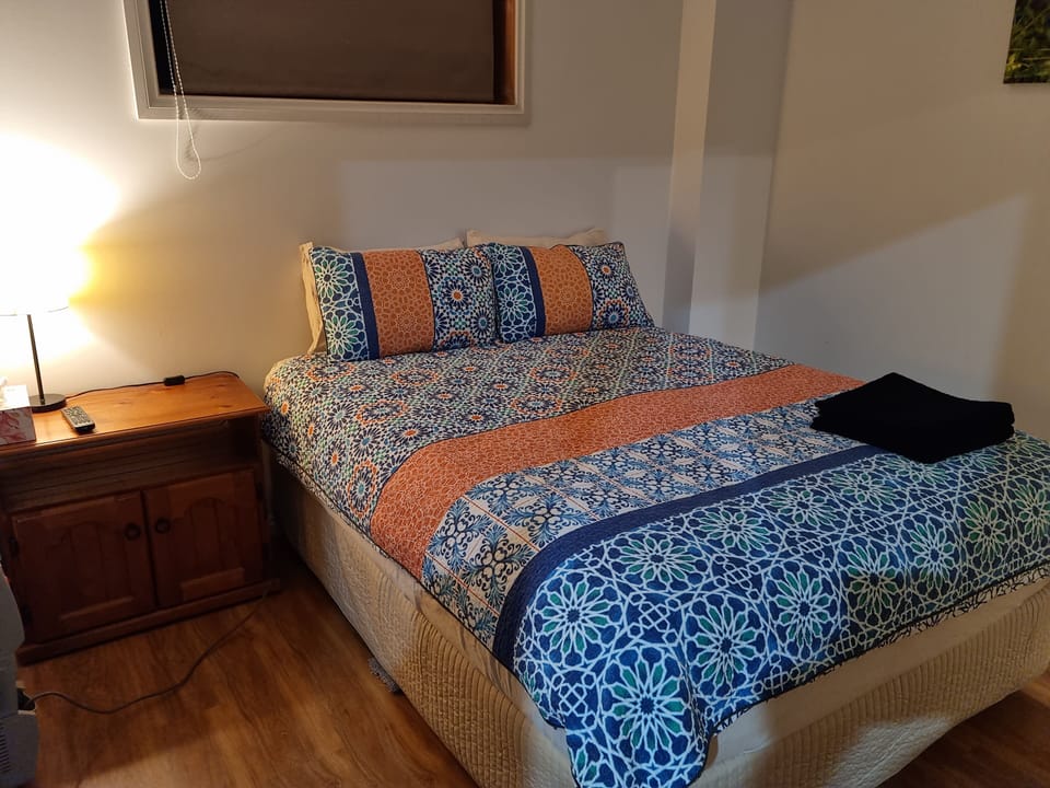 Night stand and light with power points on both sides of the bed