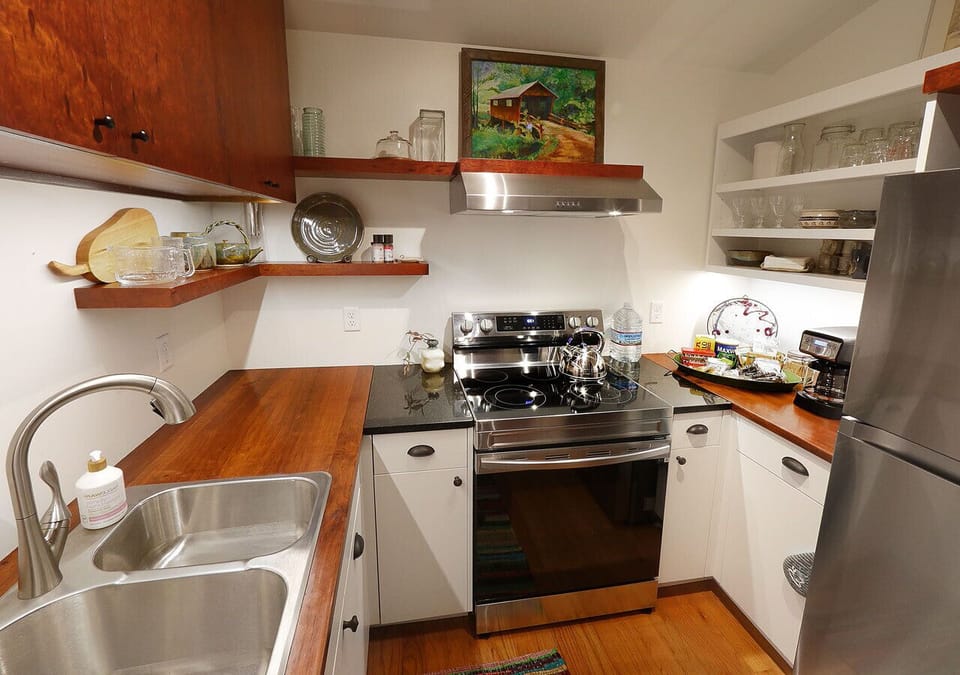 Kitchen; open to office-living room, full size refrigerator, cooking & bake ware