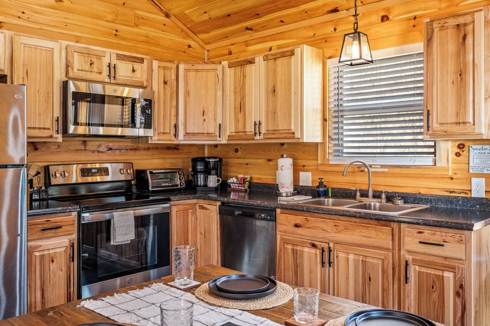 Modern Kitchen – A fully stocked kitchen with rustic wood finishes 