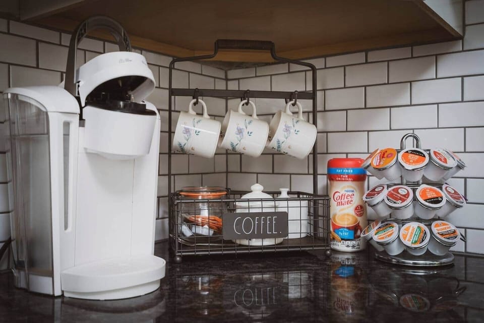 Keurig coffee pot and plenty of pods, sugar, and tea bags for the tea kettle.