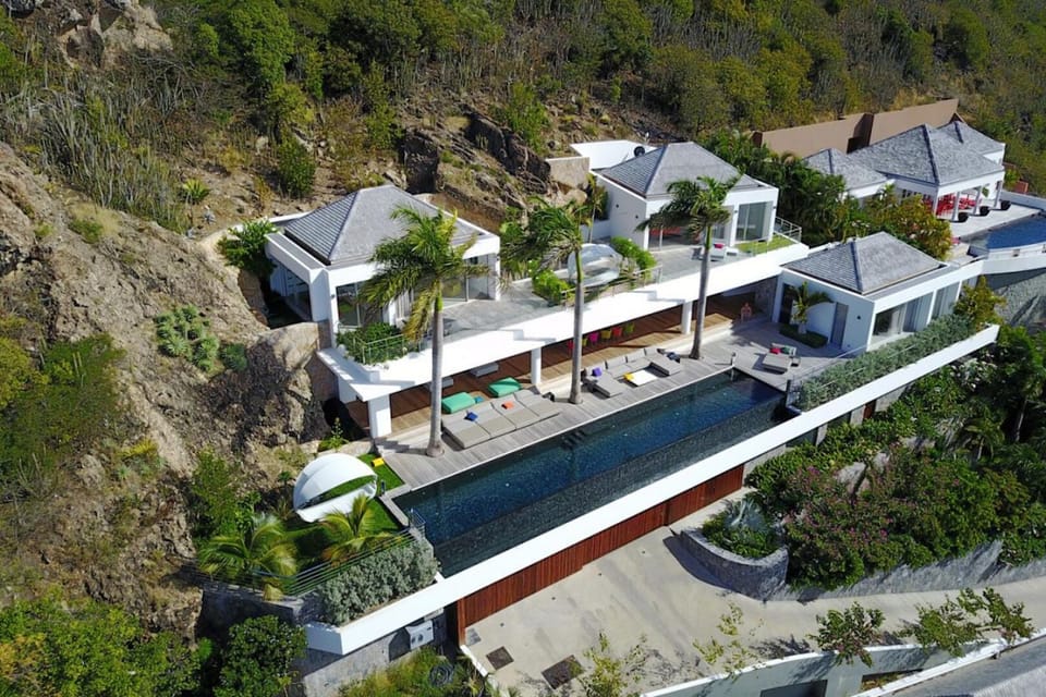 Outdoors: Multi-level property, with private elevator, and several lounge areas on private terraces.