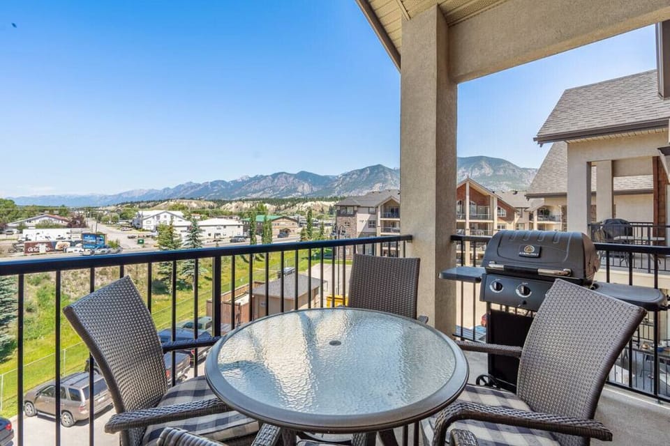 Private, top-floor balcony with outdoor seating, a BBQ (propane included) and Rocky Mountain views.