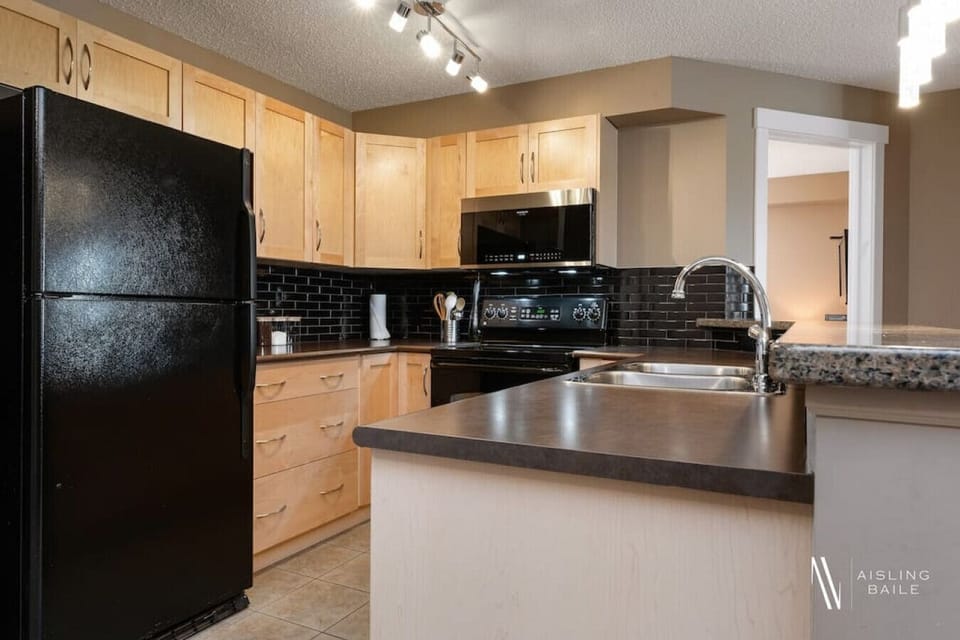 Full kitchen with a drip coffee machine, ground coffee, tea, sugar and basic condiments (ketchup, mustard and relish.)