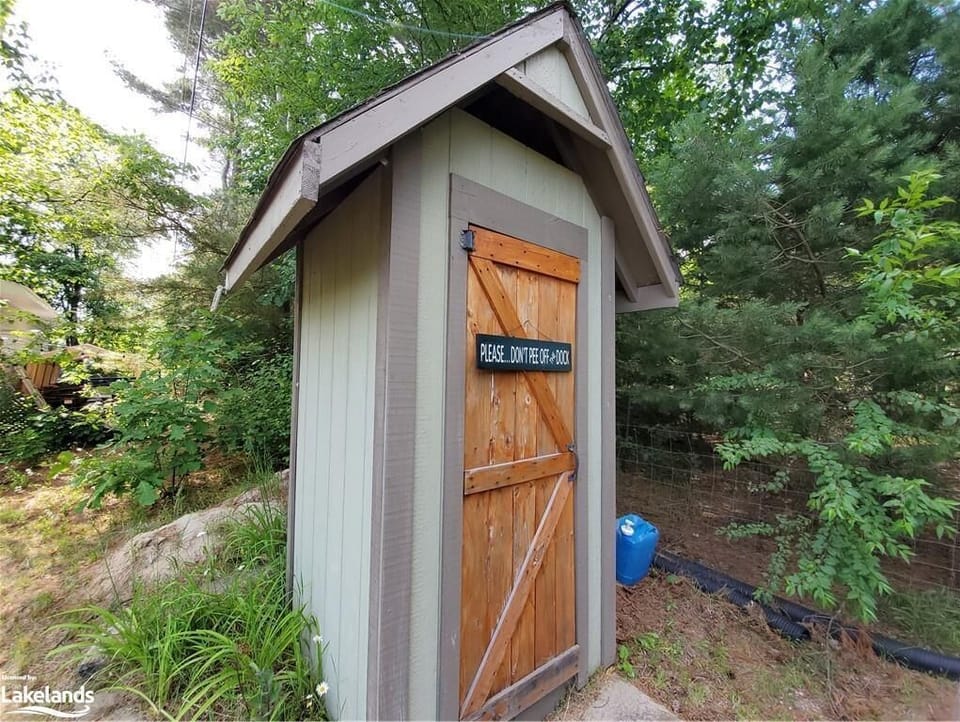 Outdoor privy for convenience.