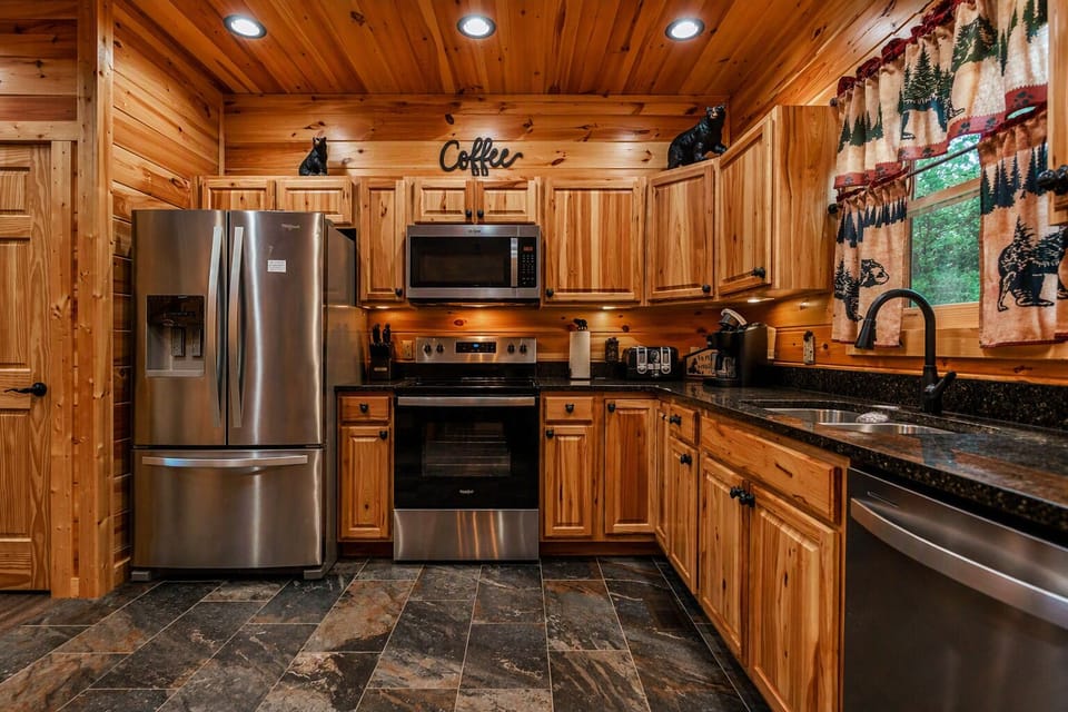 Enjoy a spacious kitchen with a full washer and dryer hidden neatly behind the door—perfect for extended stays